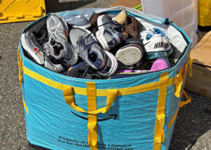 Huge bin of sneakers and shoes