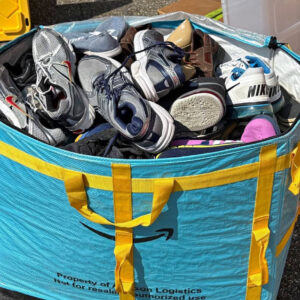 Huge bin of sneakers and shoes